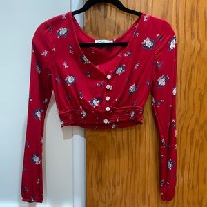 A red floral cropped long sleeve from Hollister, size XS.